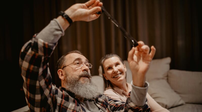 Happy senior couple laughing and enjoying their time together indoors.